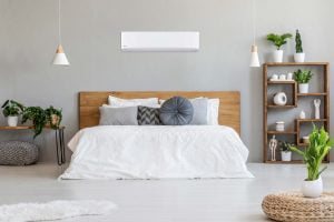 A modern bedroom with a heat pump