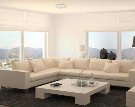 White lounge space with ducted aircon in the white ceiling